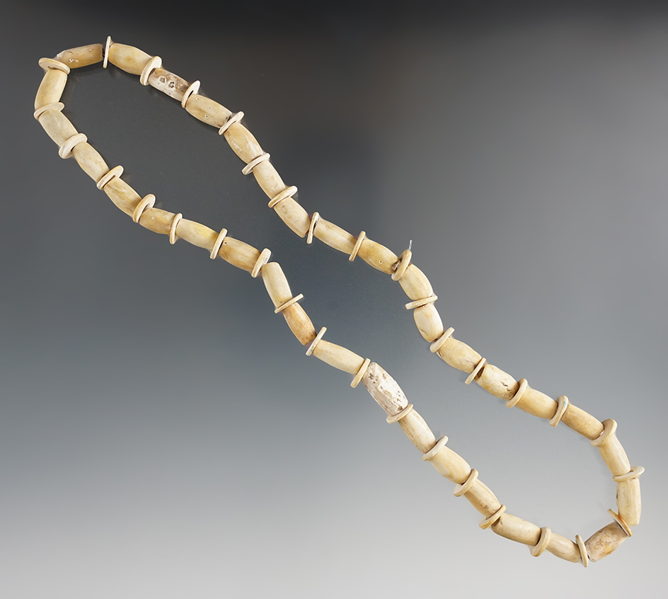 15" strand of drilled shell beads found in LeFlore Co., Oklahoma. Ex. Tommy Beutell.