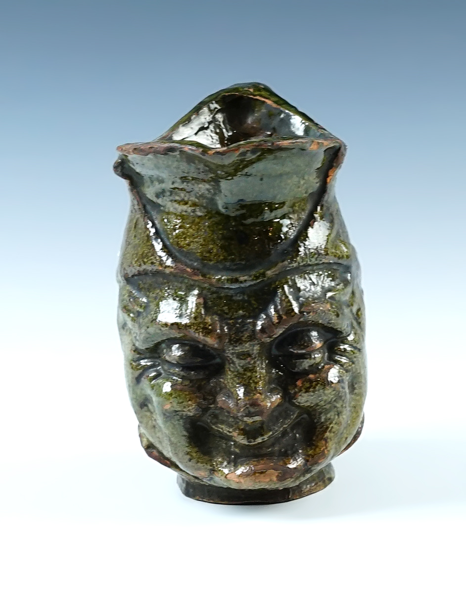 Exceptional green glazed Spanish Colonial handled pitcher recovered in Peru. 