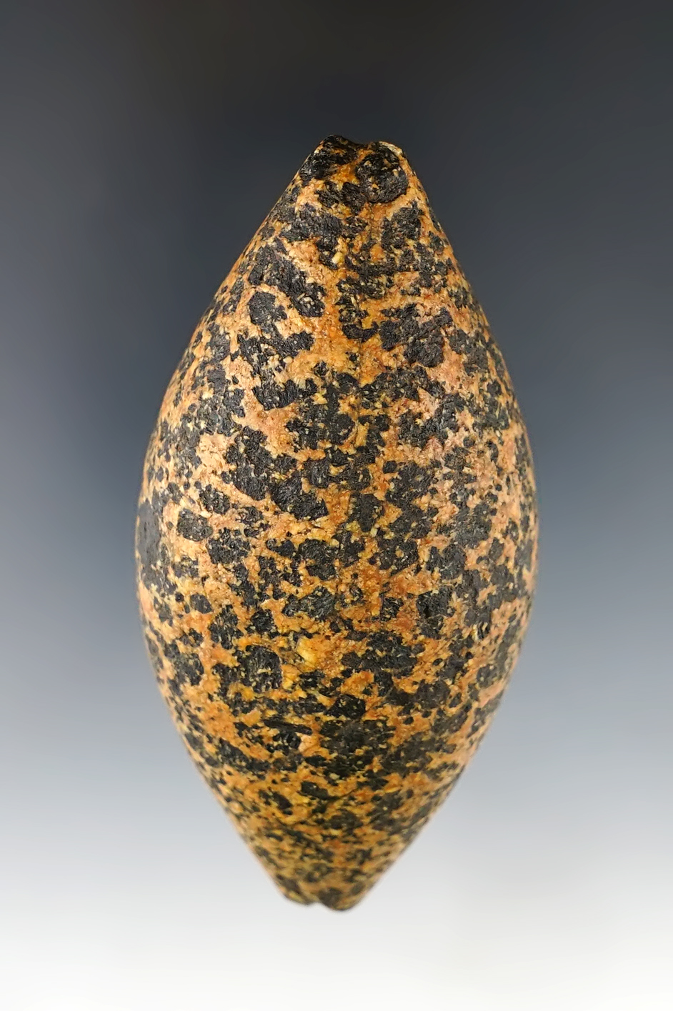 3 1/2" highly colored Plummet made of orange and black Granite. Nice overall finish. Michigan.