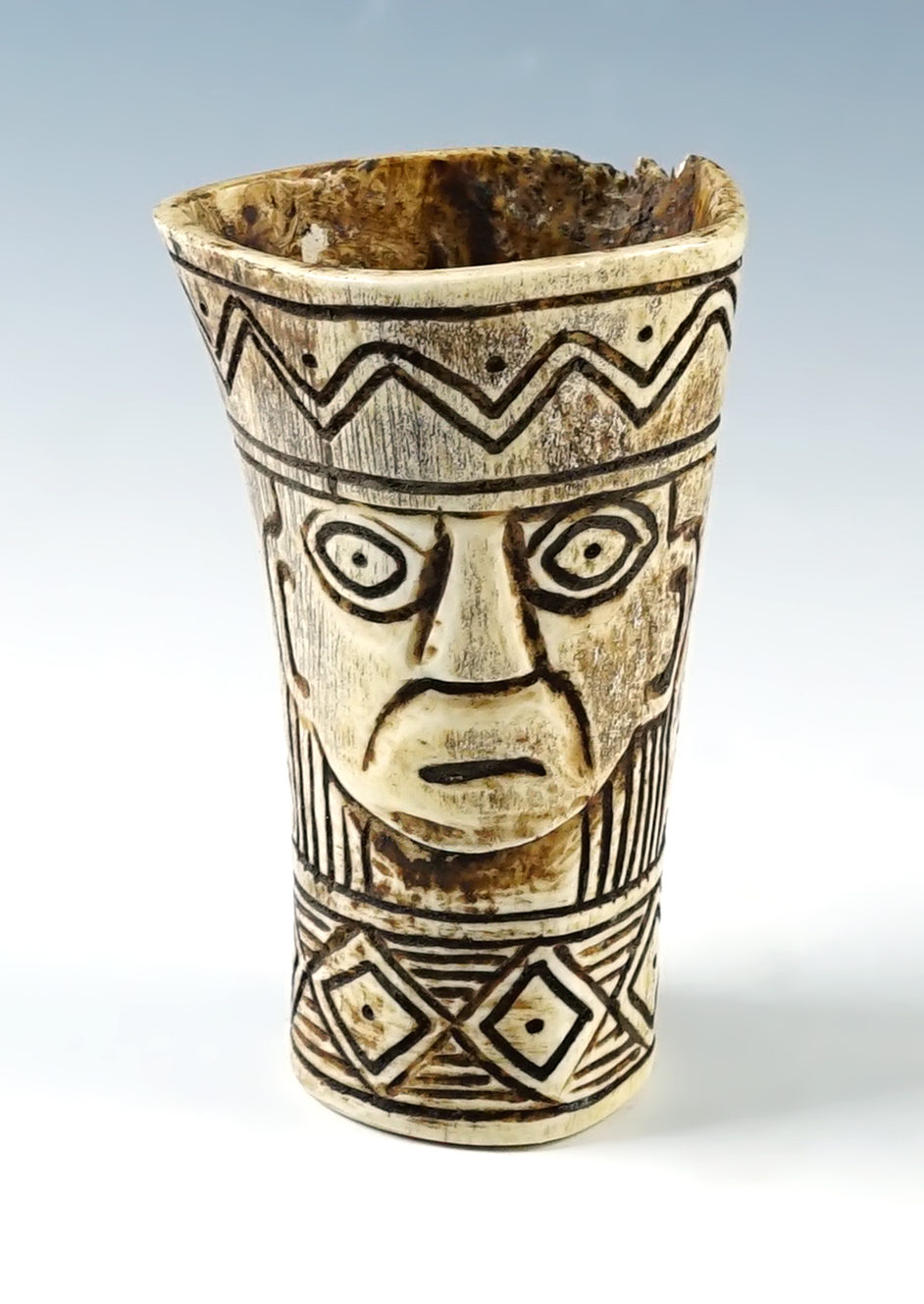 3 1/2" tall  Llama bone medicine cup depicting a Ruler and a Jaguar. In very nice condition. 