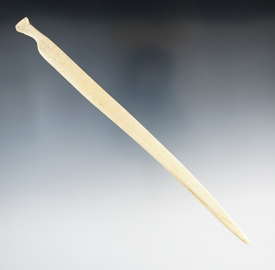 Nicely styled and well polished 7 11/16" Bone Awl with a unique animal effigy.