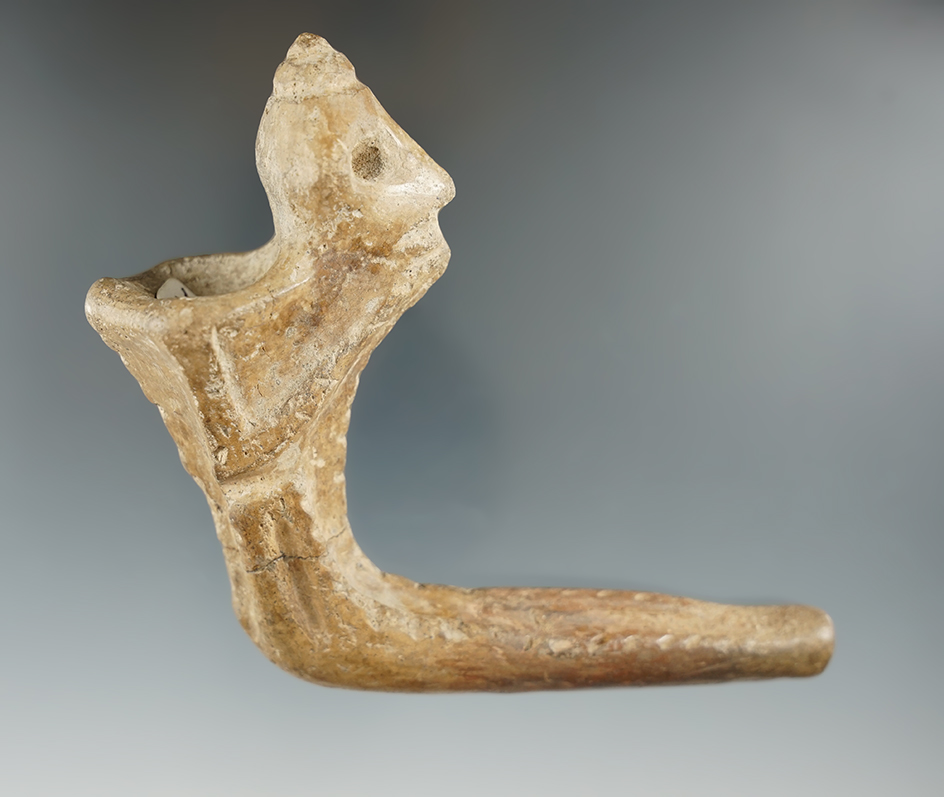 4 5/8" Iroquois clay pinched face pipe - broken and reglued at elbow/some restoration.