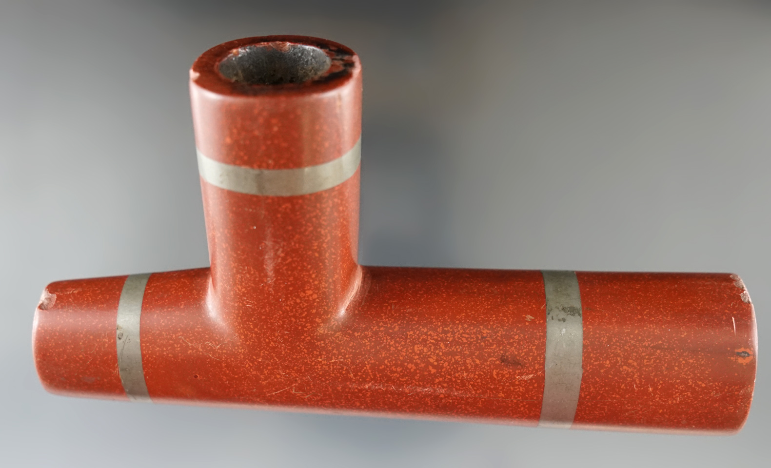 5 1/2" Catlinite Elbow Pipe with lead inserts. Late 19th or early 20th century. Found in Indiana.