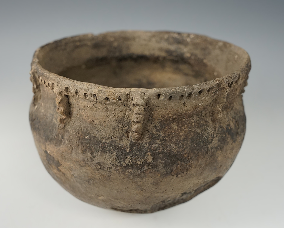 5 1/4" wide shell tempered clay pottery vessel with a nicely decorated rim -some restoration.