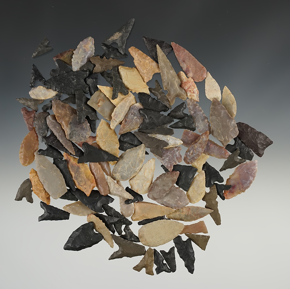 Large group of African Neolithic points made from colorful flint.