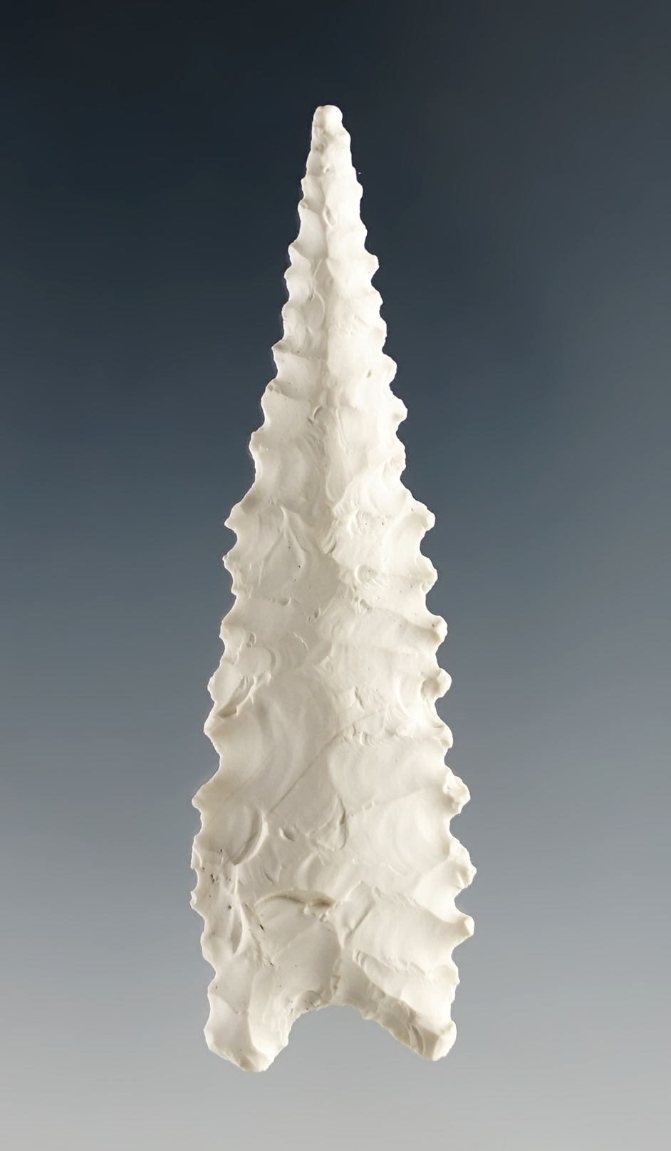 2 3/8" Humboldt concave base that is thin with exceptional flaking and serrations. Nevada.