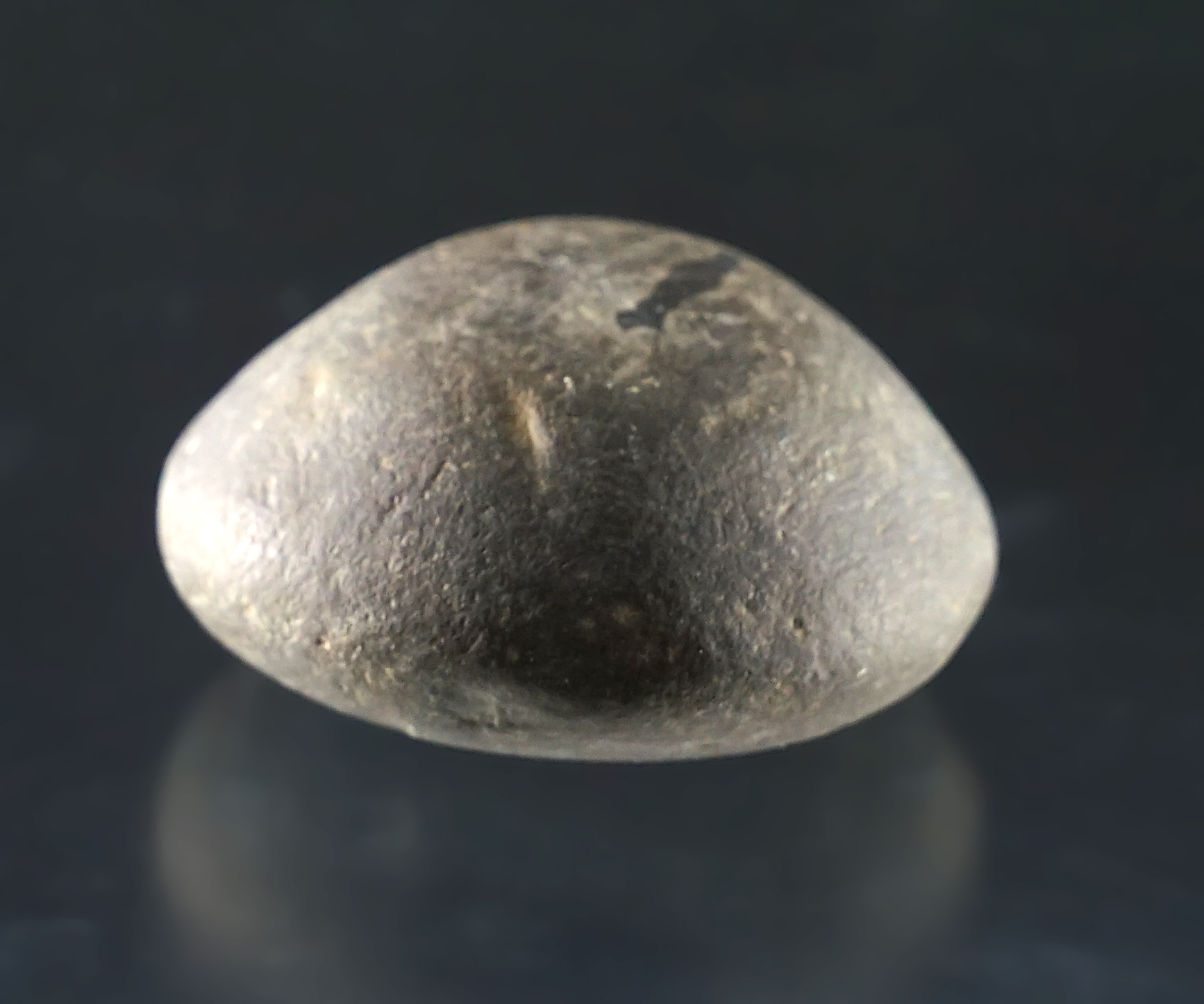 Patinated 1 13/16" Hardstone Cone found in Knox Co., Missouri. Ex. Gauge Craig collection.