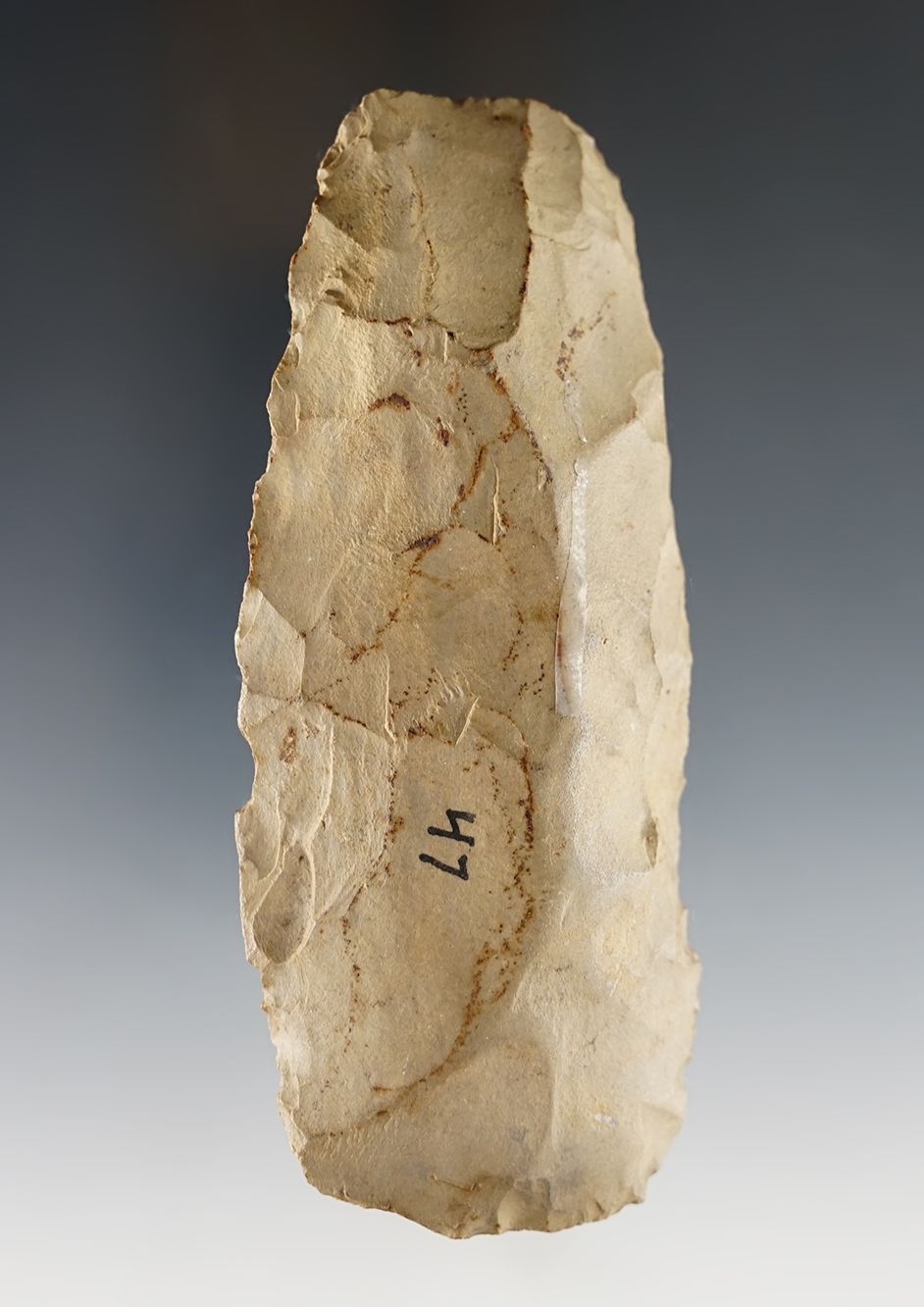 4 5/8" Flint Celt with nice use polish to the bit. Found in Mississippi.