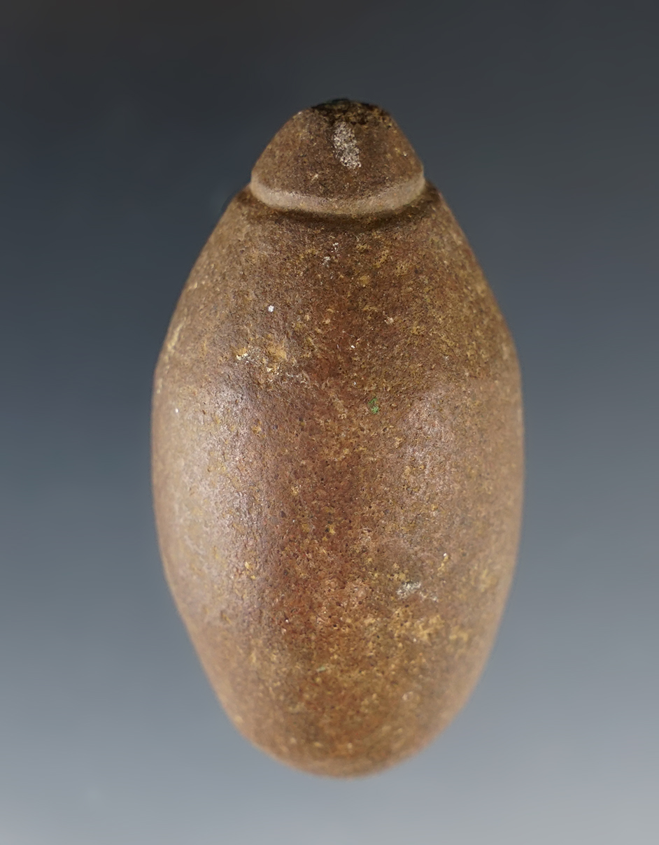 2 3/8" long Grooved Plummet found in Wisconsin. A nicely made example.