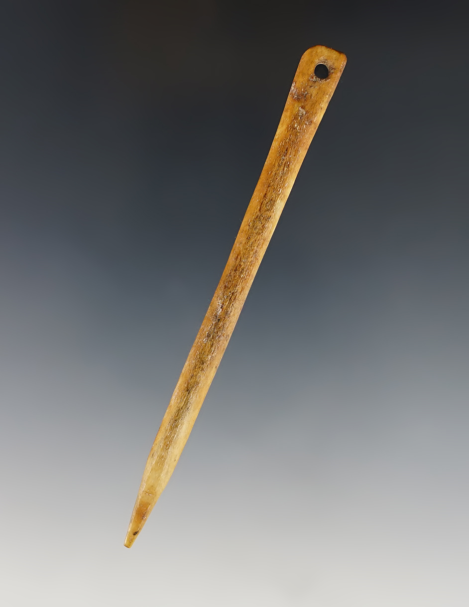 4 5/16" well patinated drilled bone needle recovered in southern Ohio..