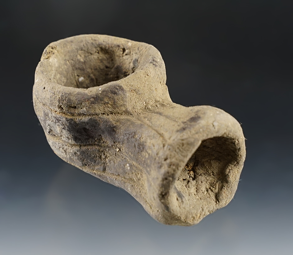 3 5/8" long pipe made from clay recovered in Arkansas.