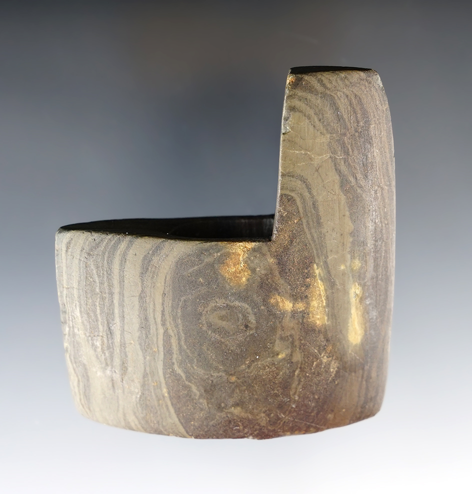 Classic style 2 3/8" Archaic Geniculate with nice mineral deposits on surface. Found in Wood Co., Oh