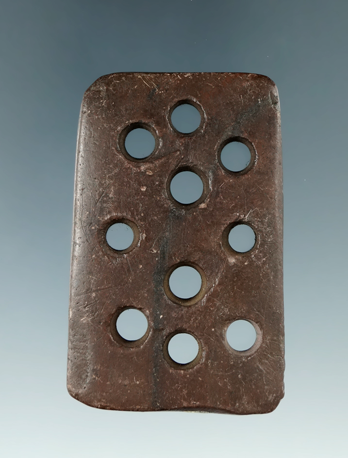 2 5/16" Red Slate with 10 perforations found in Medina Co., Ohio.