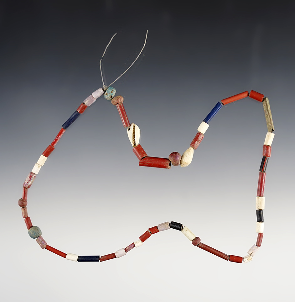 16" Strand of red, blue straw, wampum, redwood and "Dutch" blue beads.  Lima, New York. 