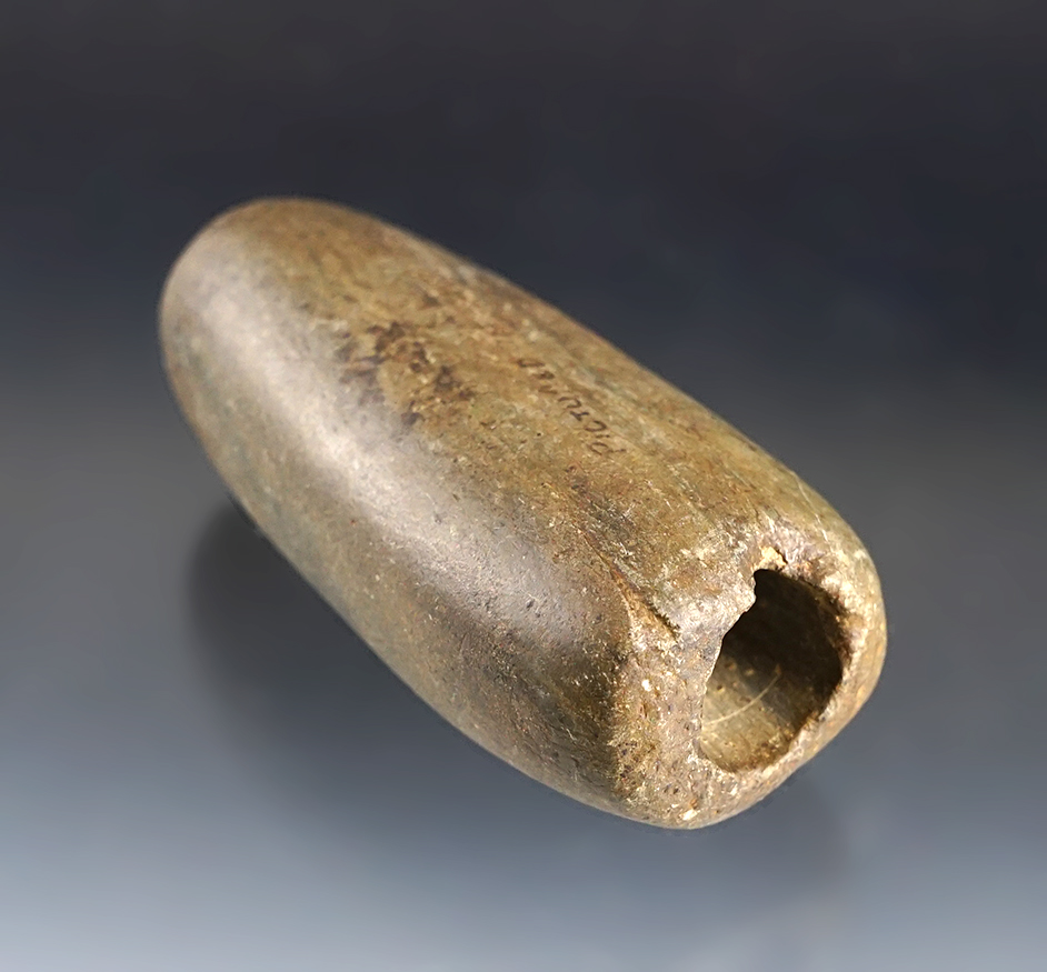 3 1/4" Tubular Bannerstone that is heavily patinated with nice mineral deposits in the hole.