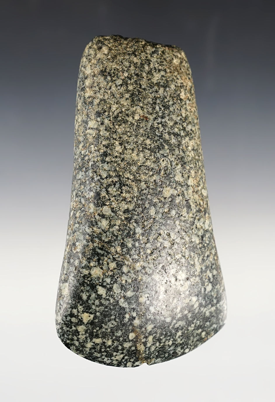 Excellent style on this 4 1/2" Flared Bit Celt that is heavily patinated. Found in St. Clair Co., Illinois. Ex. Myers collection. 