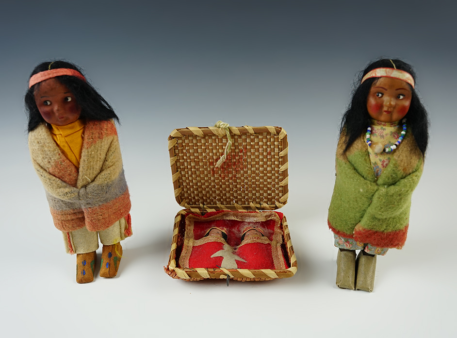 Pair of 6 1/2" tall Vintage Skookum Dolls with two babies in a basket. This is a very nice set. 