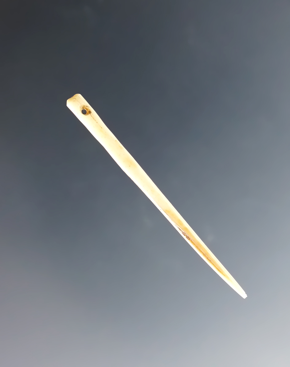1 3/4" incredibly fine and delicate Bone Needle. Found in the Four Corners area.