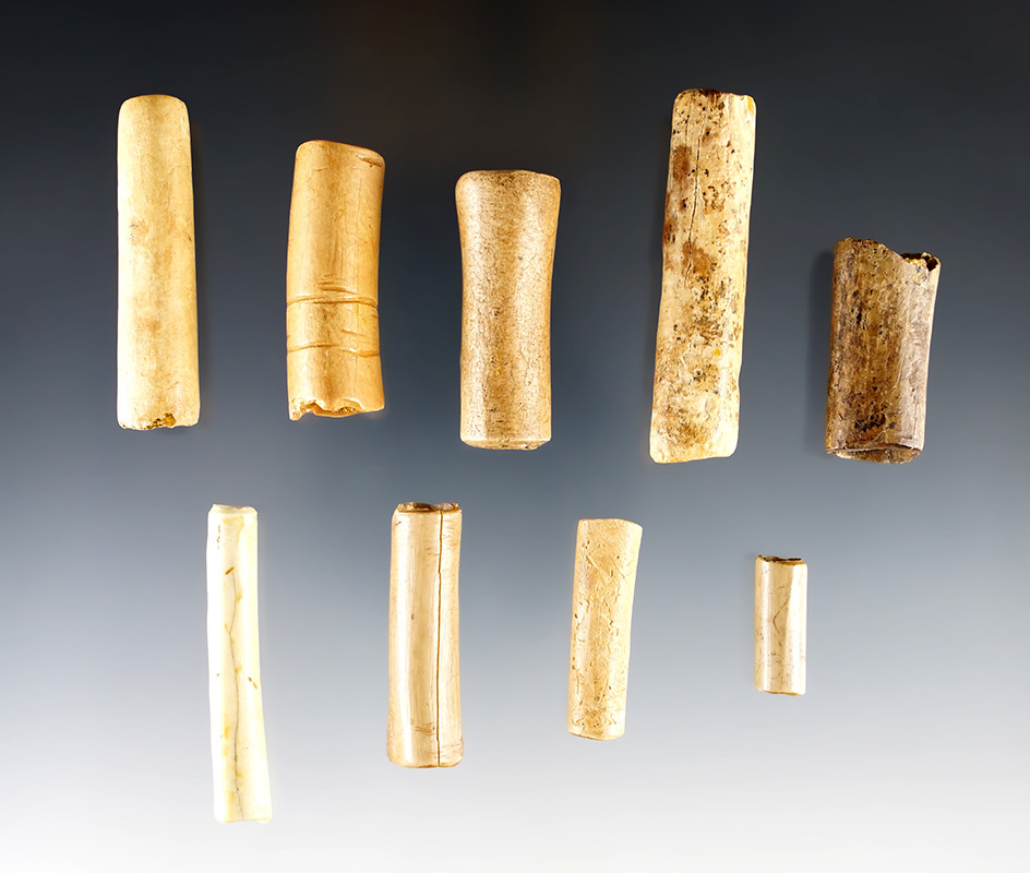 Set of 9 Bone Beads in good condition. Found in New York. The largest is 2 1/8".