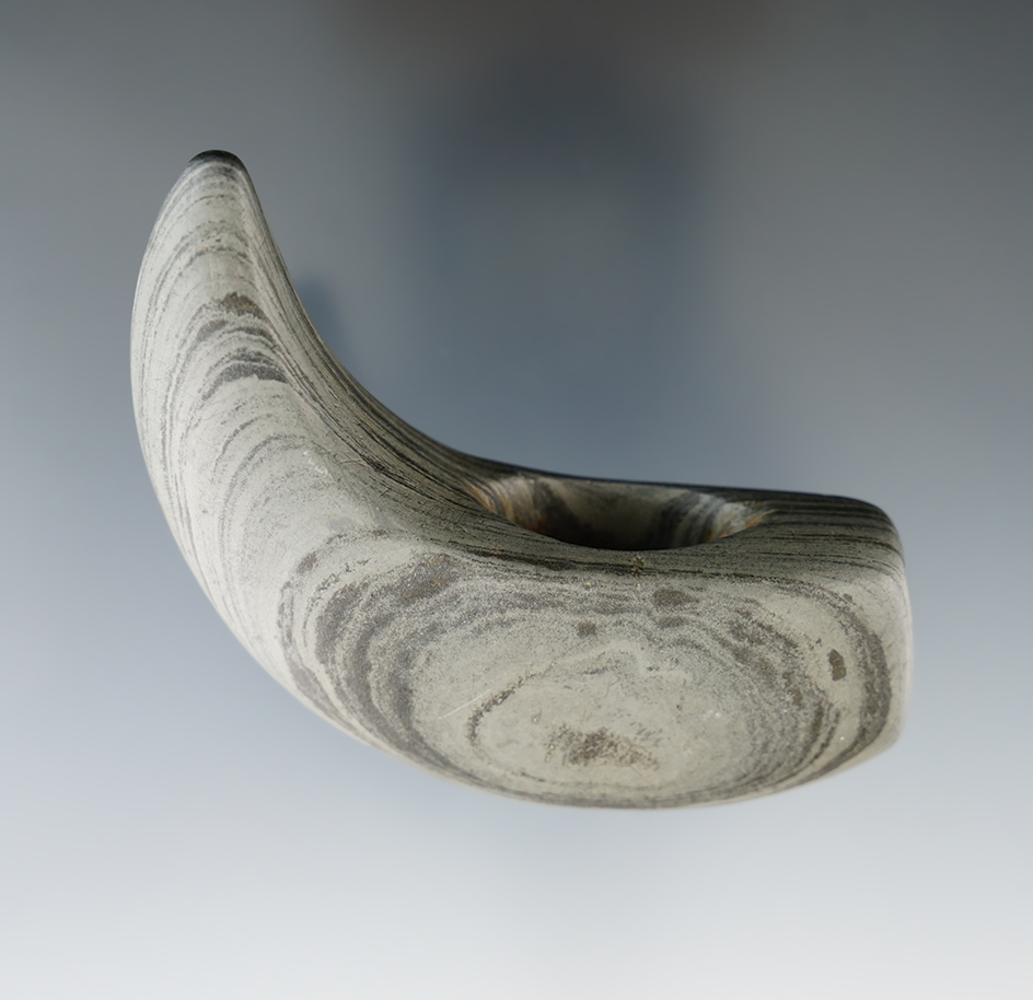 2 3/4" Archaic Geniculate made from gray and black Banded Slate. Found in Henry Co., Ohio.