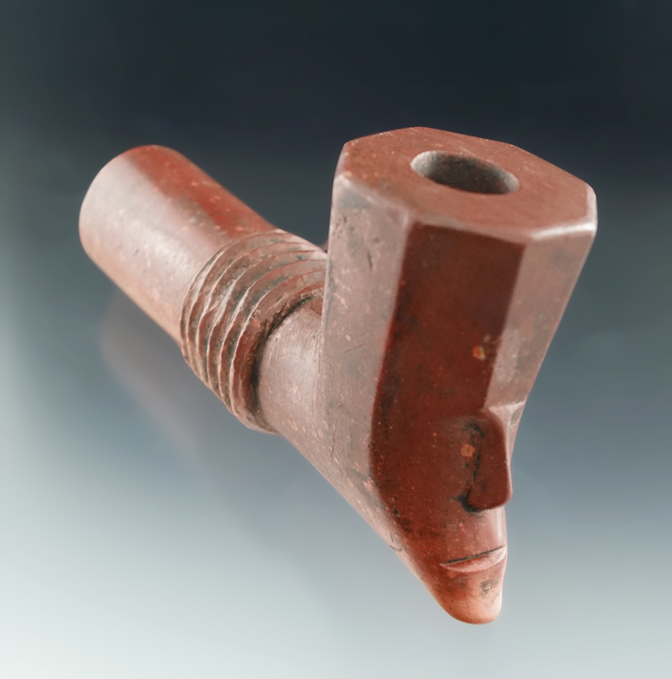 4 5/16" well styled Catlinite pipe with an octagon bowl and human face effigy.