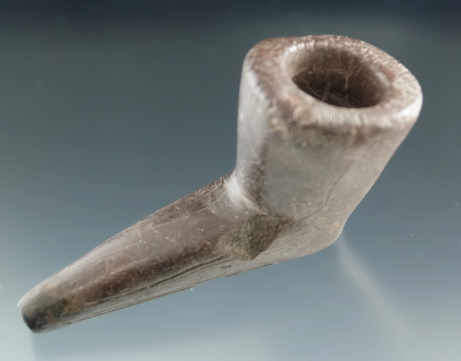 3 5/16" Owasco purple slate pipe with nice incised line carvings on exterior. New York. Restored.