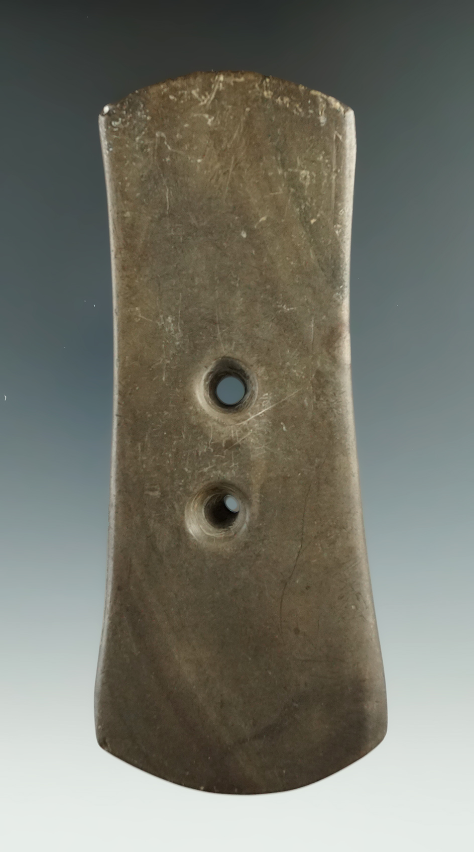 Uniquely styled 4 3/4" Bi-concave gorget found near Montezuma, New York.   Ex. Ed French.