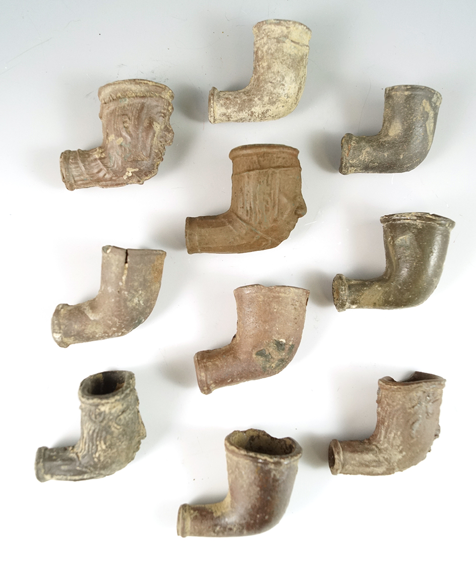 Group of 11 assorted clay trade pipes in various conditions found in New York.