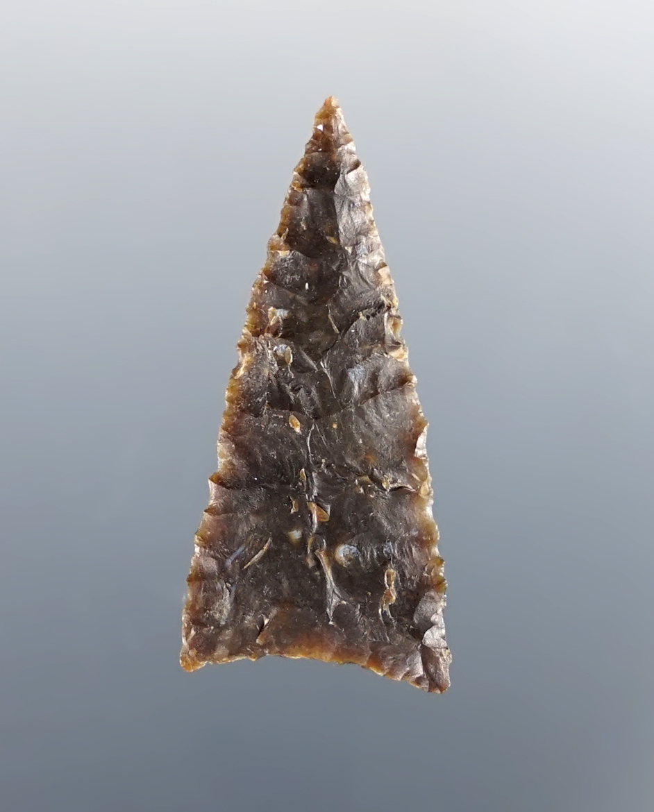 1 5/16" beautifully flaked Triangle Point made from Knife River Flint. Found in North Dakota.