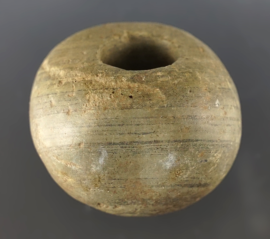 1 1/2" Fluted Ball Bannerstone that shows excellent age on surface. Found in Crawford Co., Ohio. 