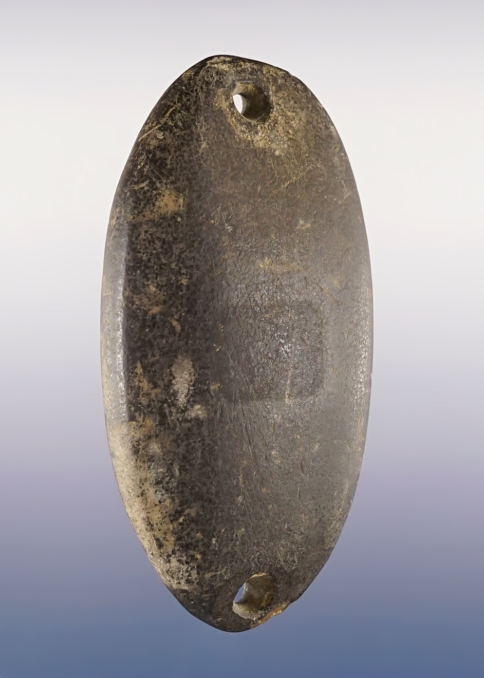 3 1/2" Gorget found in Belmont Co., Ohio. Made from patinated black Slate.