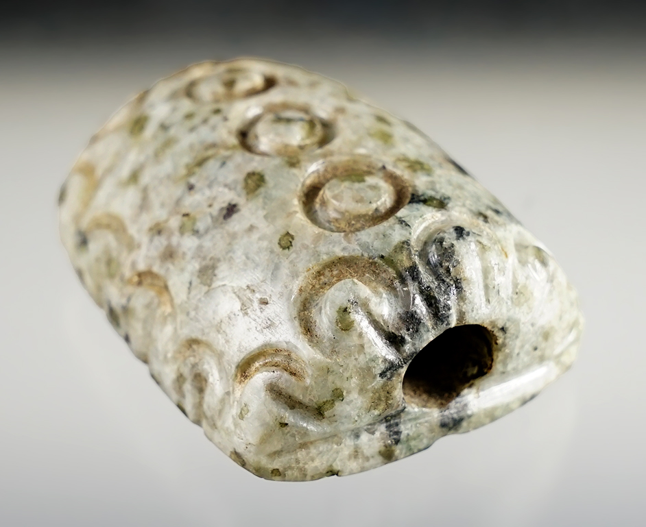 2" long by 1 5/8" wide Bannerstone made from beautiful stone with ornate exterior design. 2 COA's.