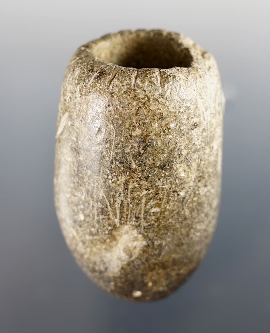 1 7/8" tall by 1 1/4" diameter Tube made from Steatite. Tallied around the top edge. Southern Ohio.