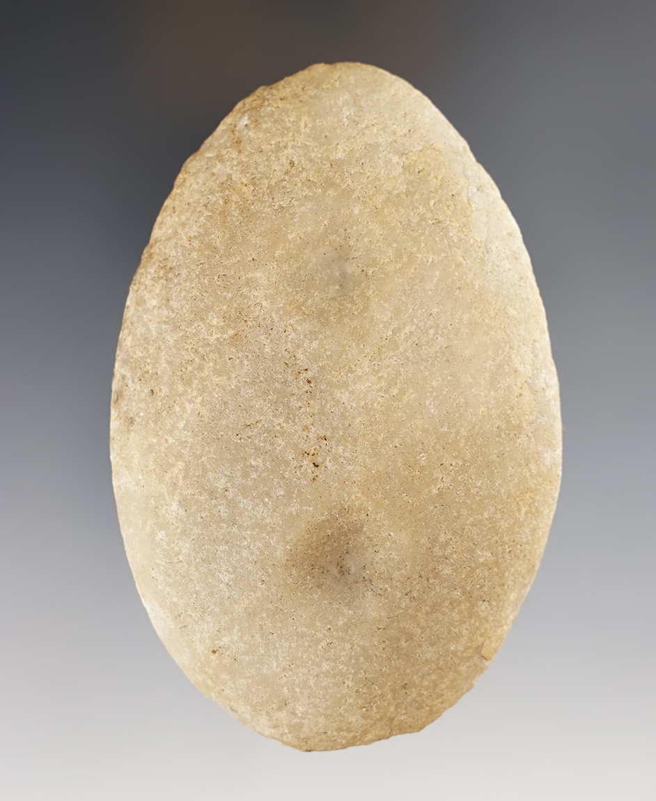 3 5/8” Oval Gorget made from patinated Quartzite. Spotted but not fully drilled.