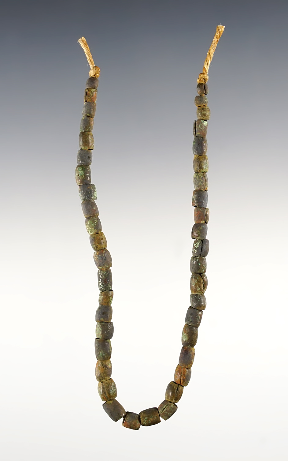 8" Strand of rolled Brass Beads recovered at the Townley-Read Site in Geneva, New York.