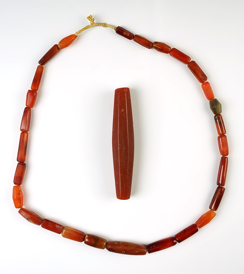 Nice set including a 4 3/8" Bead and a 24" Strand of assorted beads recovered in Africa. 