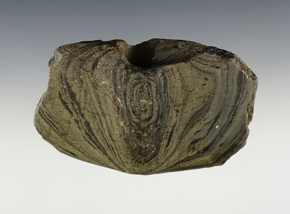 3 3/8” x 2 1/4" Wing Bannerstone that is made from green and black slate. Found in Ohio