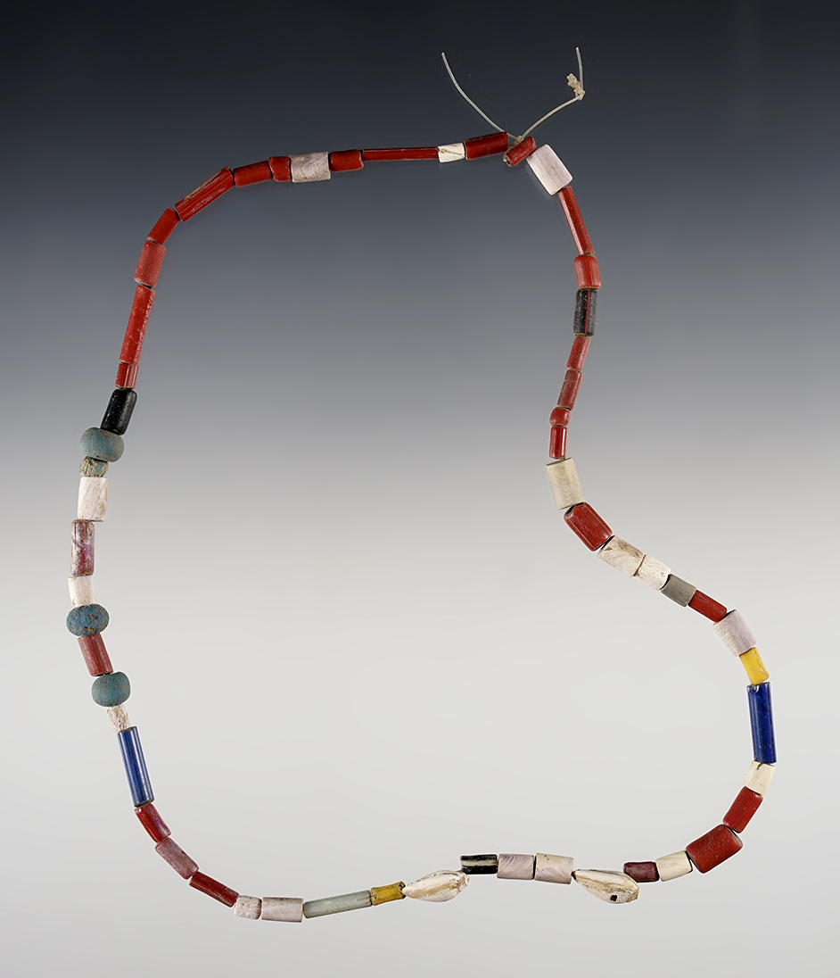 15" Strand of red, blue, yellow straw, wampum, red barrel and dutch blue Beads.  New York. 