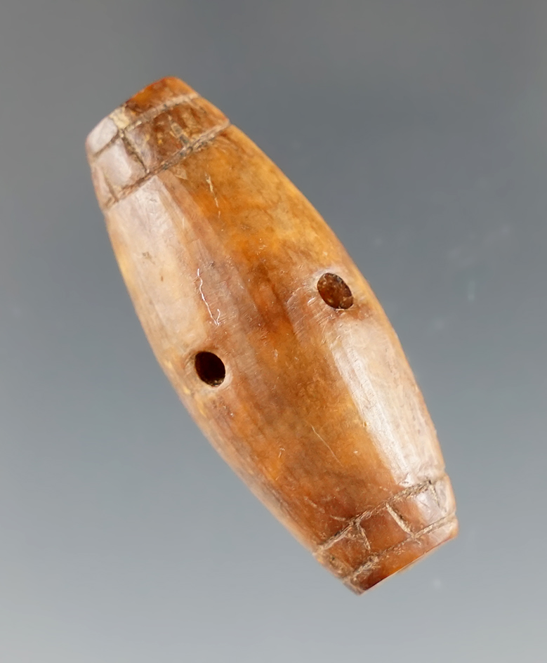 1 5/8" Stylized Drilled Bead made from bone, found in Alaska. Ex. Favell Museum, Oregon. COA.