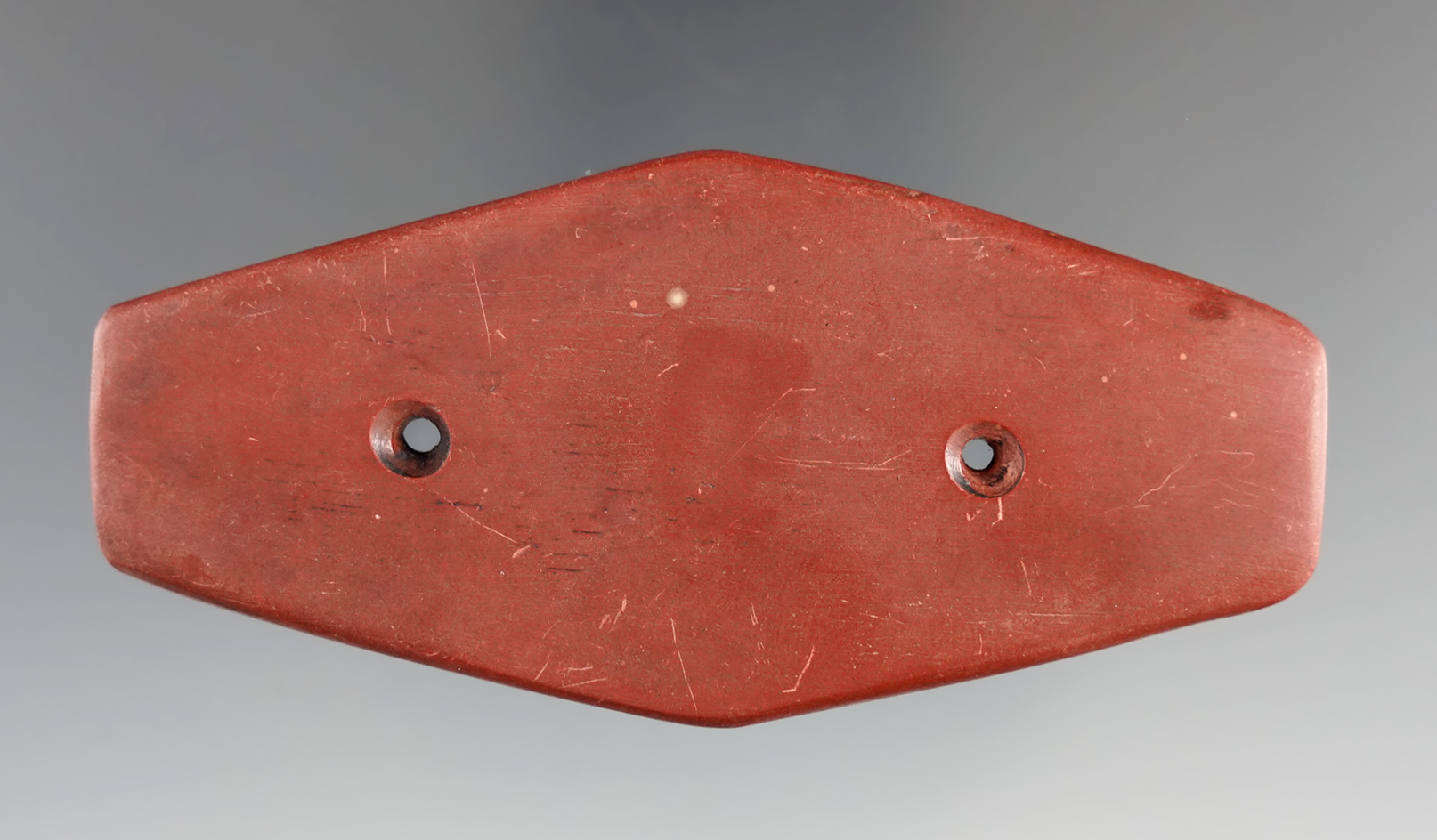 3 1/2" Catlinite Gorget found in 1961 in Minnesota. Comes with a Bennett COA.