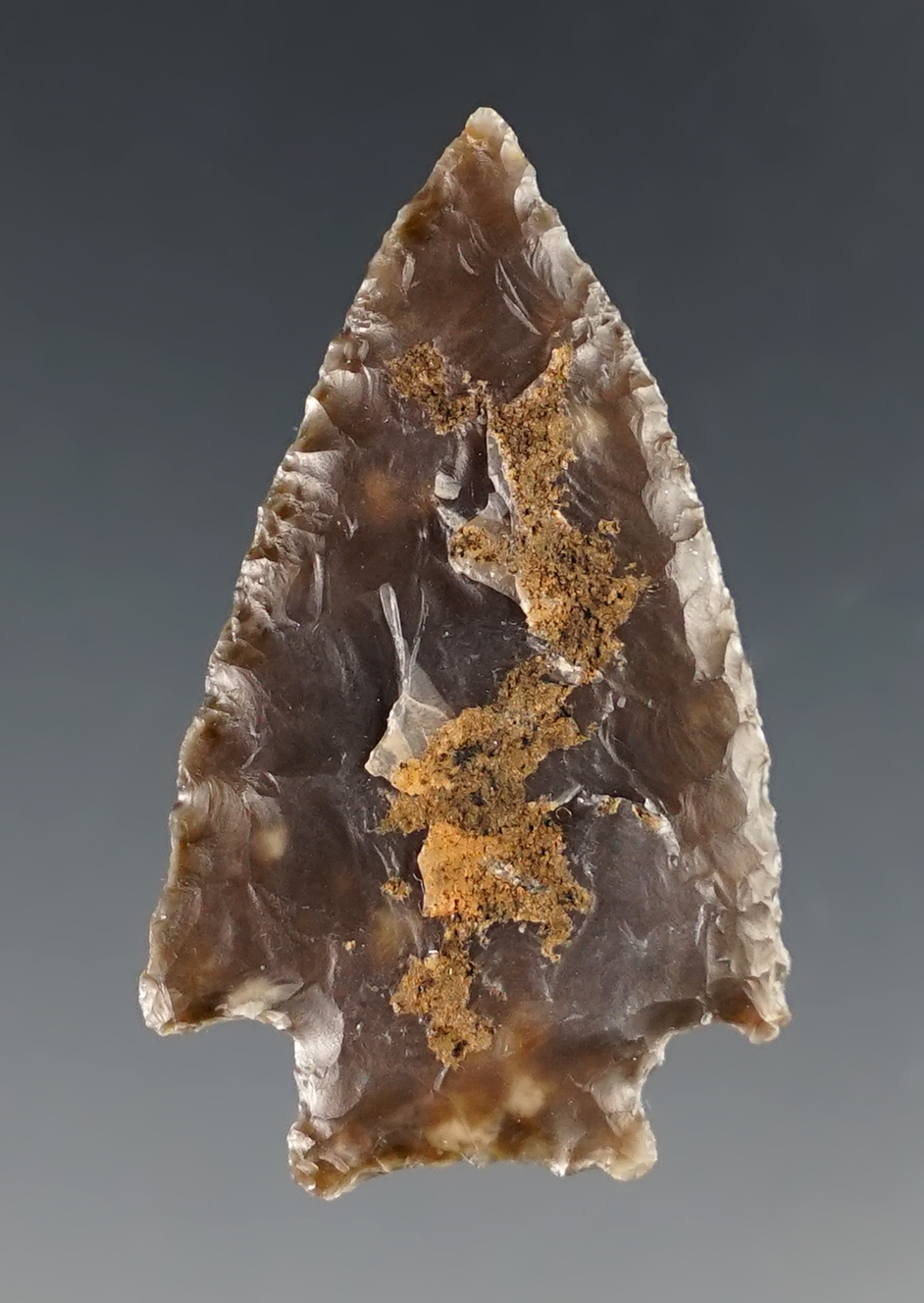 1 3/8" well patinated arrowhead found in Sweetwater Co., Wyoming. Ex. Bob Roth.
