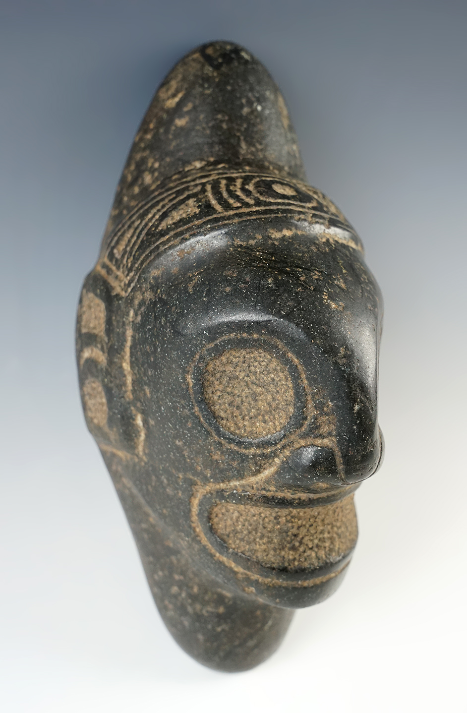 8 1/2" x 3 1/2" Taino Three Pointer Stone with Macorix Head Motif. Recovered in Hispaniola. 