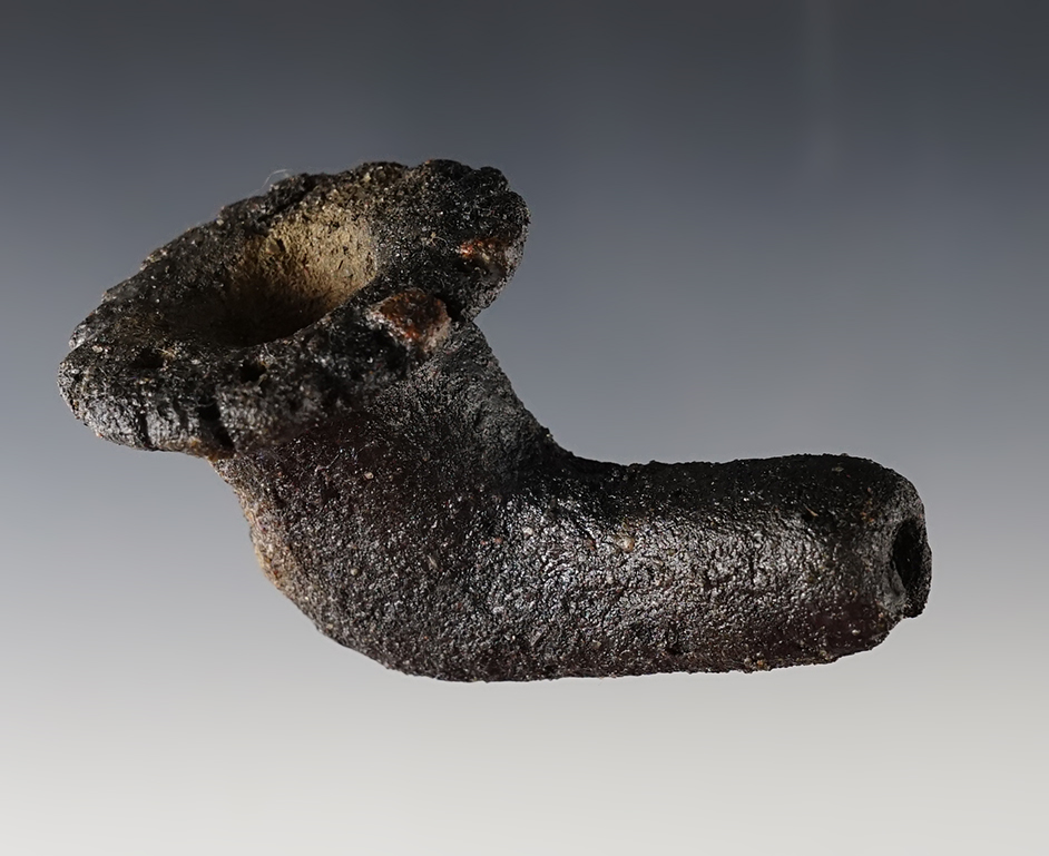 3 1/4" clay pipe with a fringed bowl. Exact found location unknown. Most likely Great Lakes area.