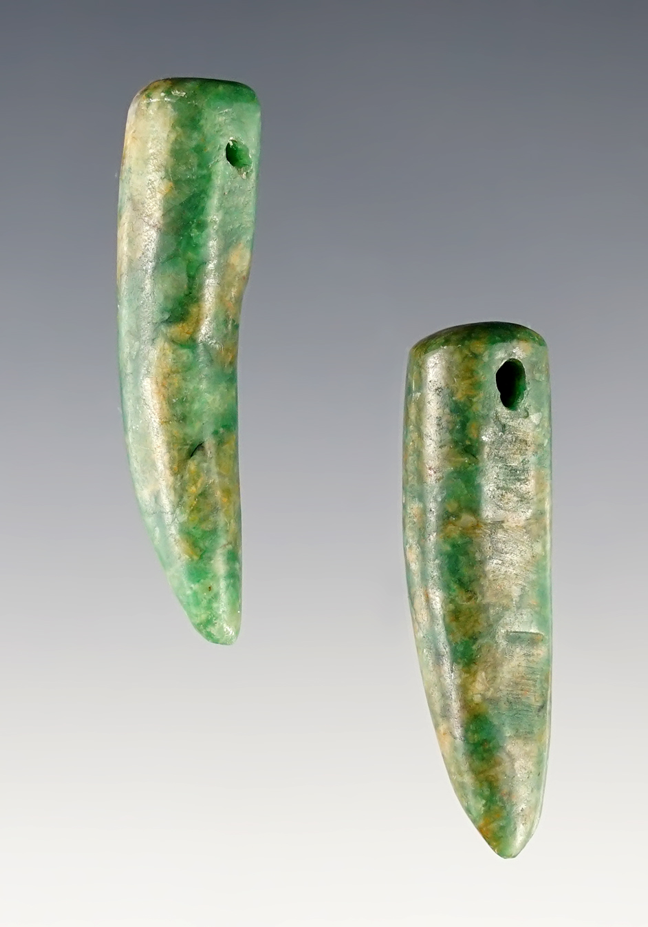 A fine matched pair of Jaguar Claw Pendants, Olmec or Protoclassic Maya, 500 BCE - 200 CE.