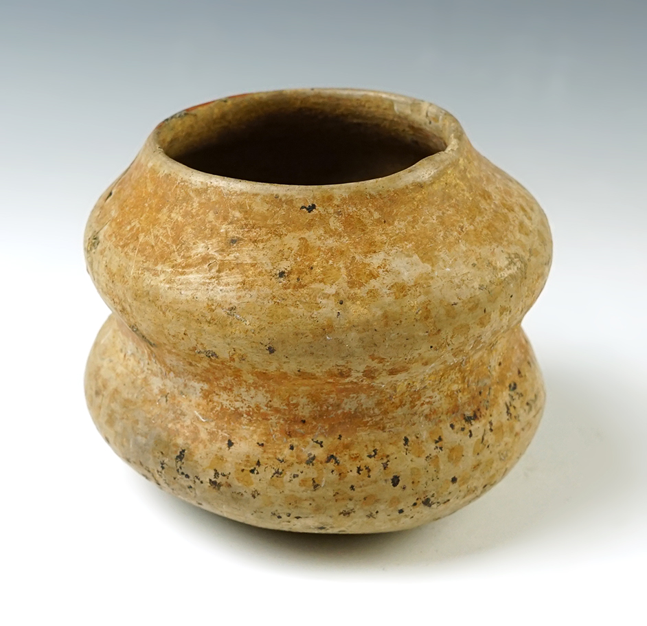 4" wide x 3 1/4" tall Pre Columbian gourd effigy pottery jar. One reglued rim chip, no restoration.