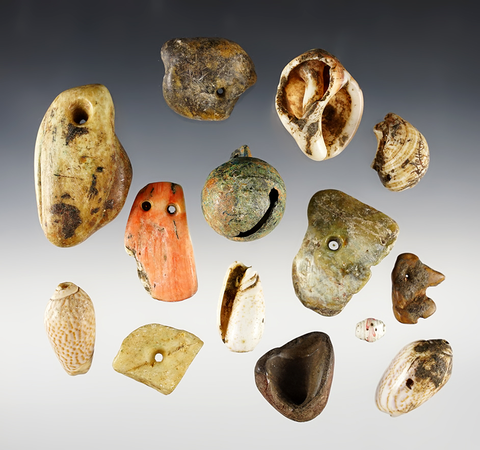 Set of Pre-Columbian shell, metal and stone Pendants, Peru, probably Inca culture. 14 pieces total. The largest is 2 7/16".