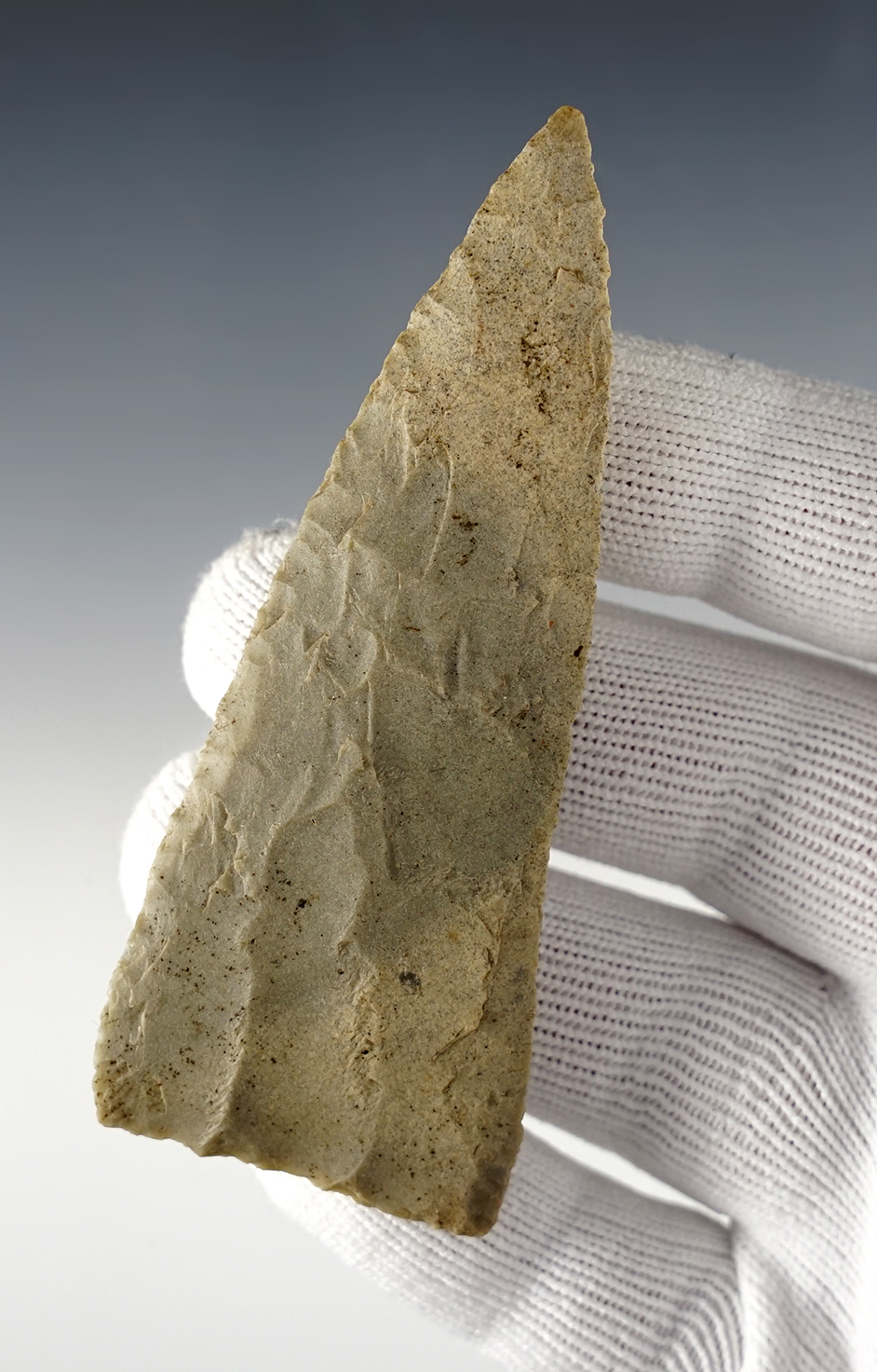 Finely flaked 3 5/8" Triangular Blade made from St. Louis Green. Found in Russell Co., Kentucky.