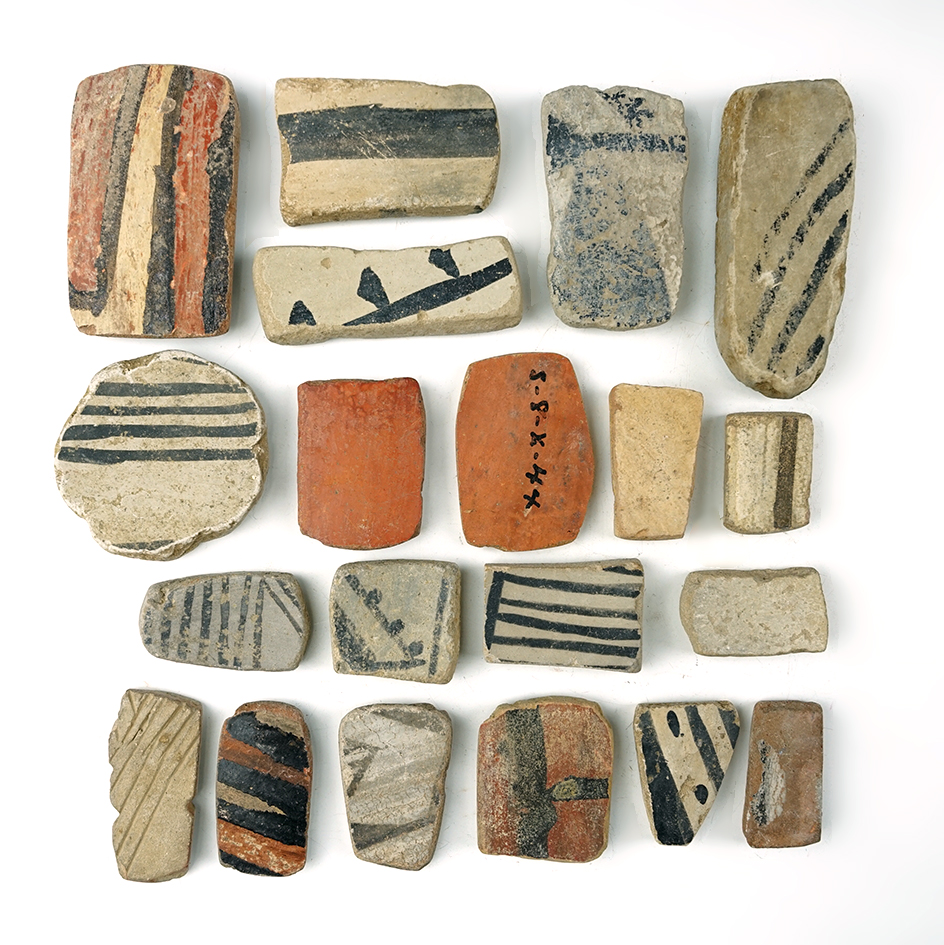 Set of 20 anciently salvaged prehistoric pottery shards sanded into various different shapes.