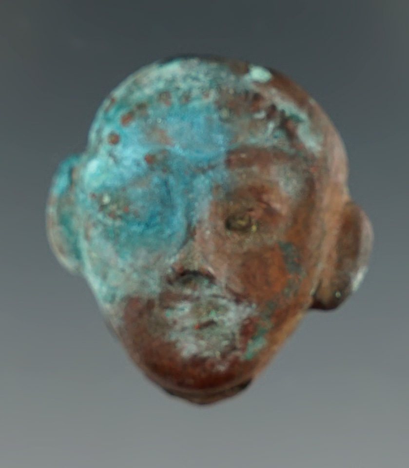 Heavily patinated pre-Columbian 1 1/8" Moche culture copper head found in Peru.