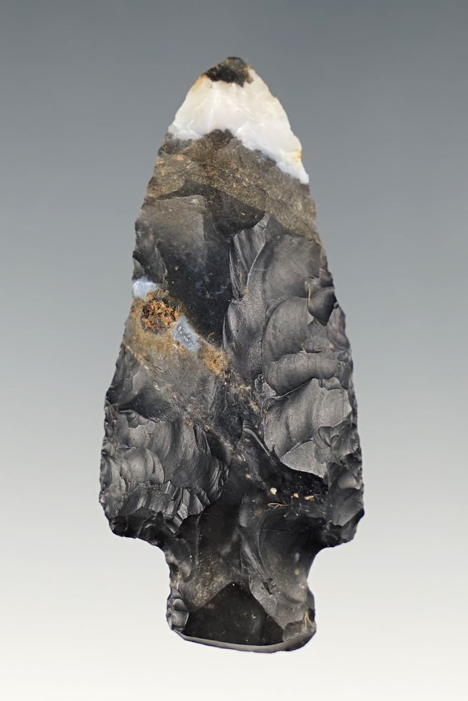 2 1/16" Stemmed point found in Ohio. Made from Coshocton flint with a large quartz inclusion.